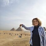Tourist visiting the Giza Pyramids in Egypt for the first time